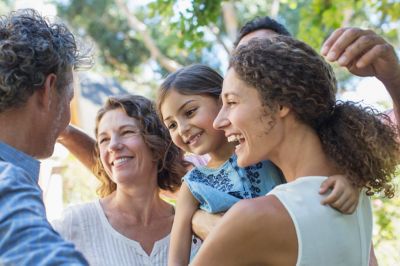 A multi-generational family enjoying time together outdoors