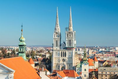 The neo-Gothic twin spires of Zagreb Cathedral rising above the city's rooftops