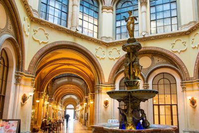The arcade of Palais Ferstel in Vienna, with vaulted corridors and a fountain