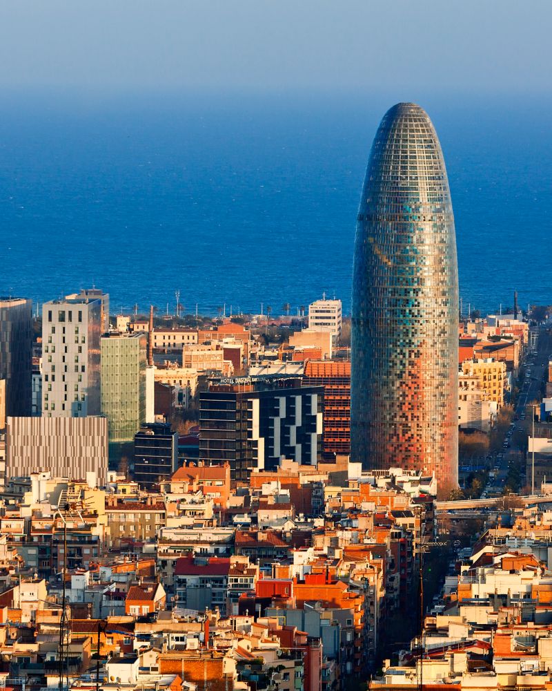 Torre Agbar with the Mediterranean in the background, Barcelona, Spain