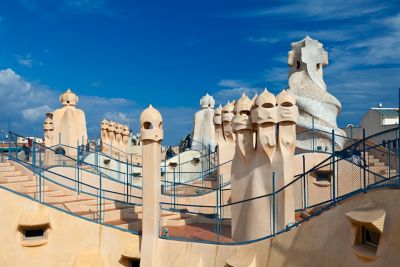 Stairs and railings on the wave-shaped rooftop of Gaudí's Casa Milà in Barcelona