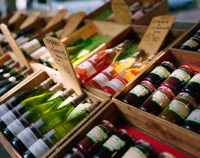 Locally produced wines and jams on sale at a market stall in Lyon, France