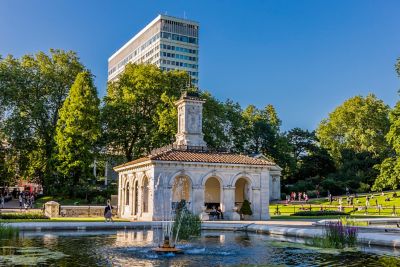 A fountain and the ornate Pump House in the Italian Gardens, part of Kensington Gardens in London