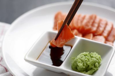 Salmon sashimi, popular in Japanese restaurants in Paris, with soy sauce and wasabi
