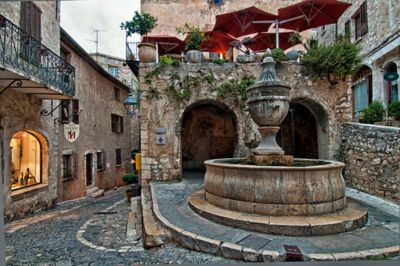 A quaint square with a fountain in the medieval village of Saint-Paul-de-Vence