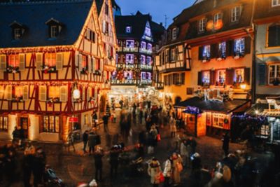 Festive lights adorn half-timbered houses in Colmar, Alsace