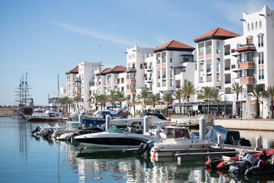 Agadir Marina in Morocco with boats and contemporary whitewashed buildings