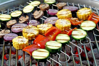 Colourful veg skewers cooking on a hot BBQ