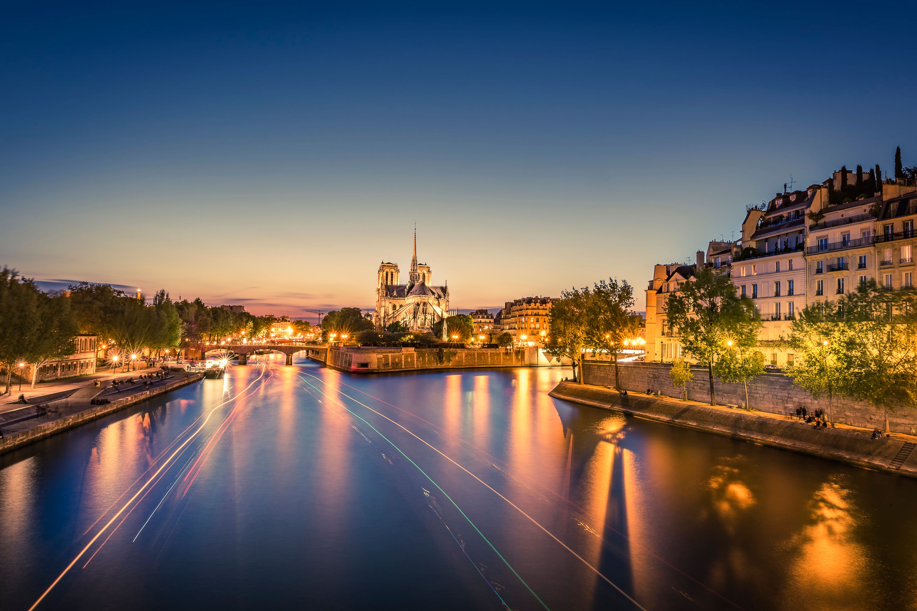 Parisian Sunset: Notre-Dame Cathedral and Seine River