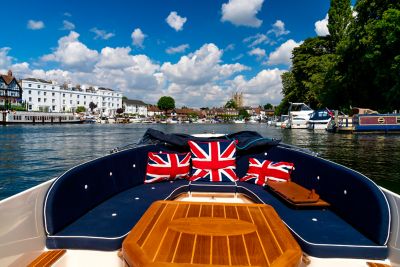 A pleasure boat on a sunny day in Henley on the River Thames, England