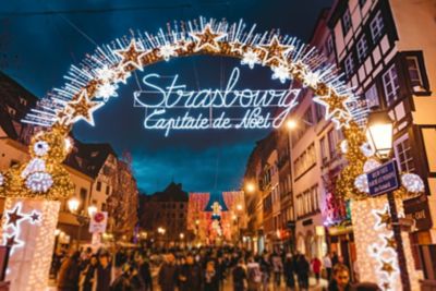 An illuminated entrance arch at the Christmas market in Alsace city centre, Strasbourg