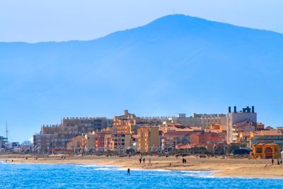 Blue waters meeting a wide sandy shore at Barcarès beach near Perpignan
