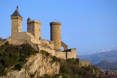 Foix Castle in France, with its three distinctive towers on a rocky hilltop