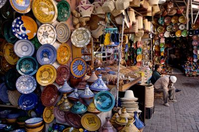 Marrakech Medina with colourful pottery, spices and woven baskets on sale