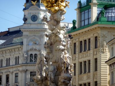 A statue in front of an imposing building on Graben street, Vienna, Austria
