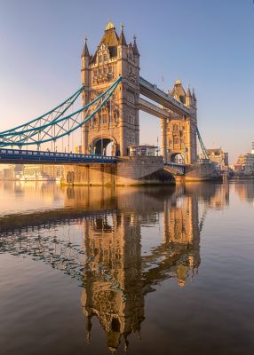 The Neo-Gothic turrets and curved suspension cables of Tower Bridge, London