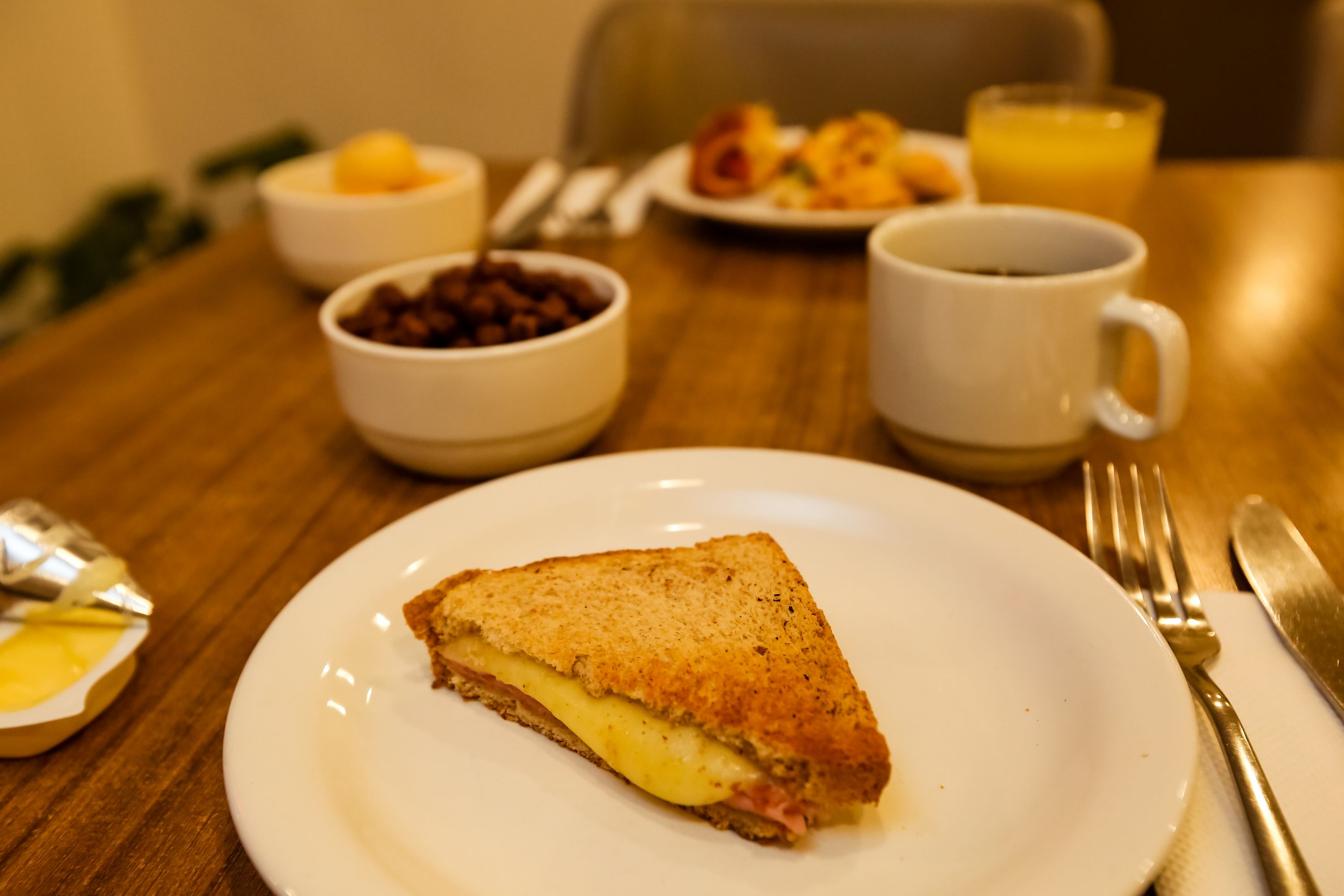 Leisurely Hotel Breakfast with Ham and Cheese Sandwich