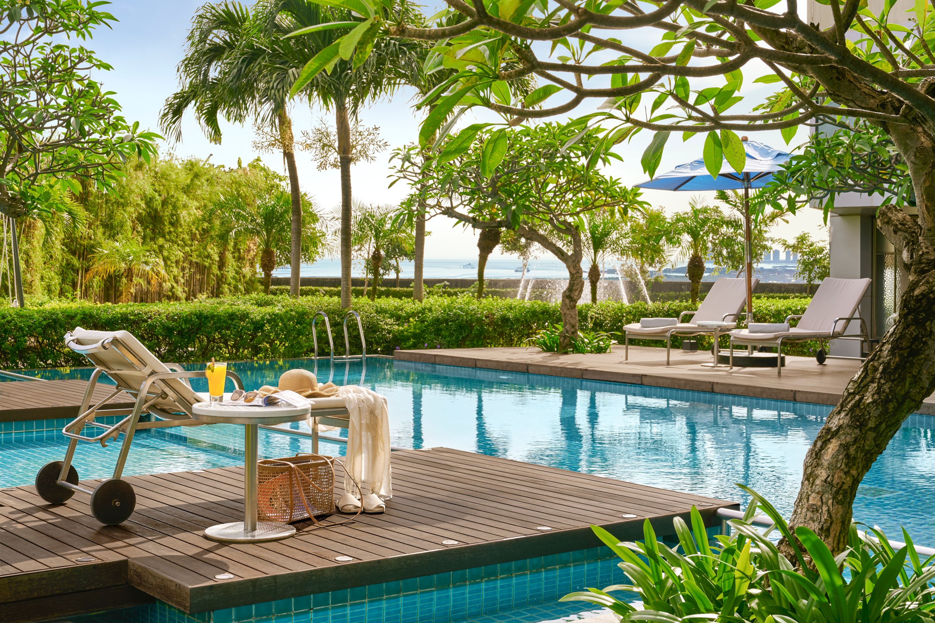 Shaded pool loungers at Mercure Jakarta Pantai Indah Kapuk in Indonesia