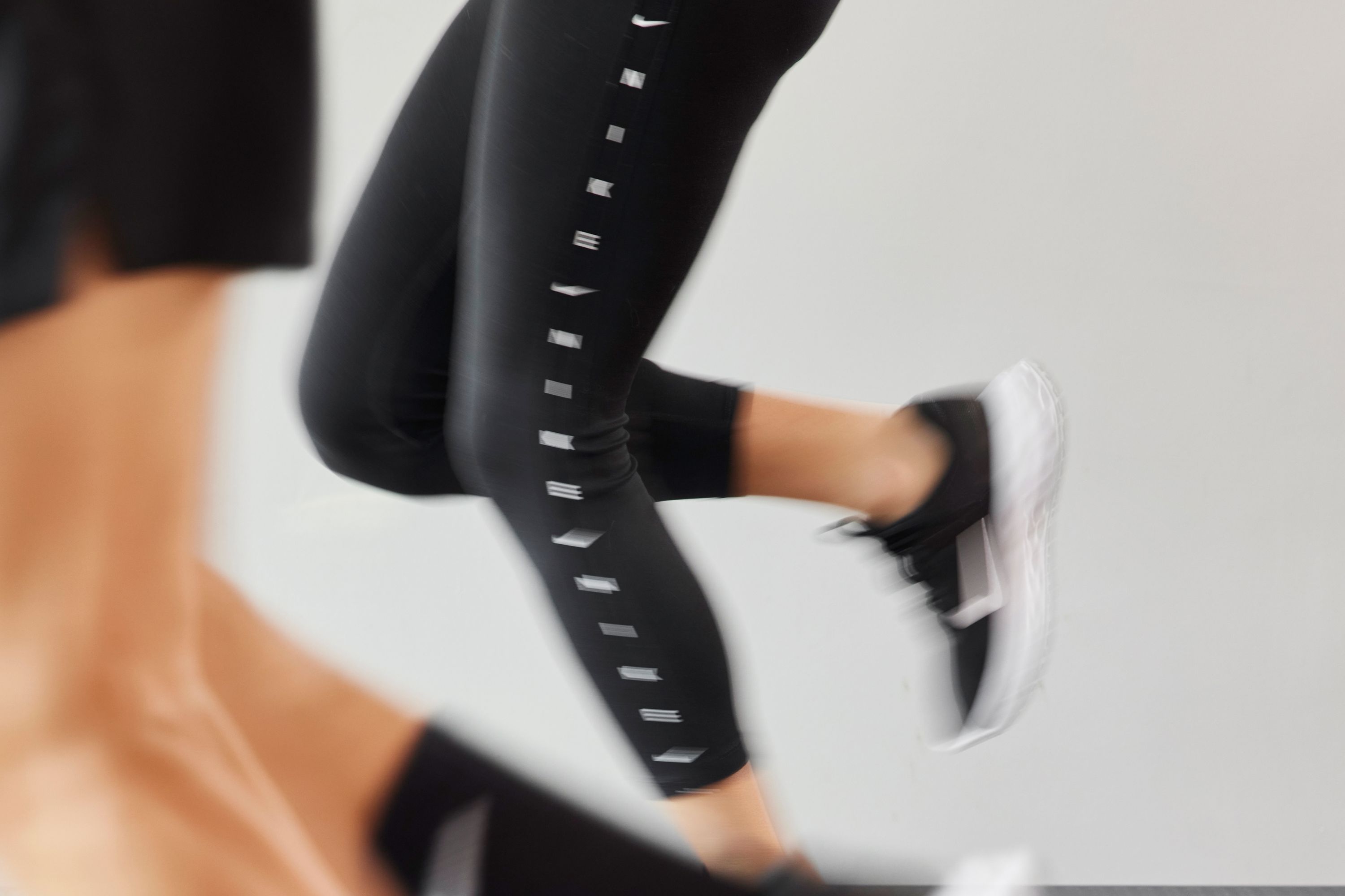 2 Individuals Running on Treadmill