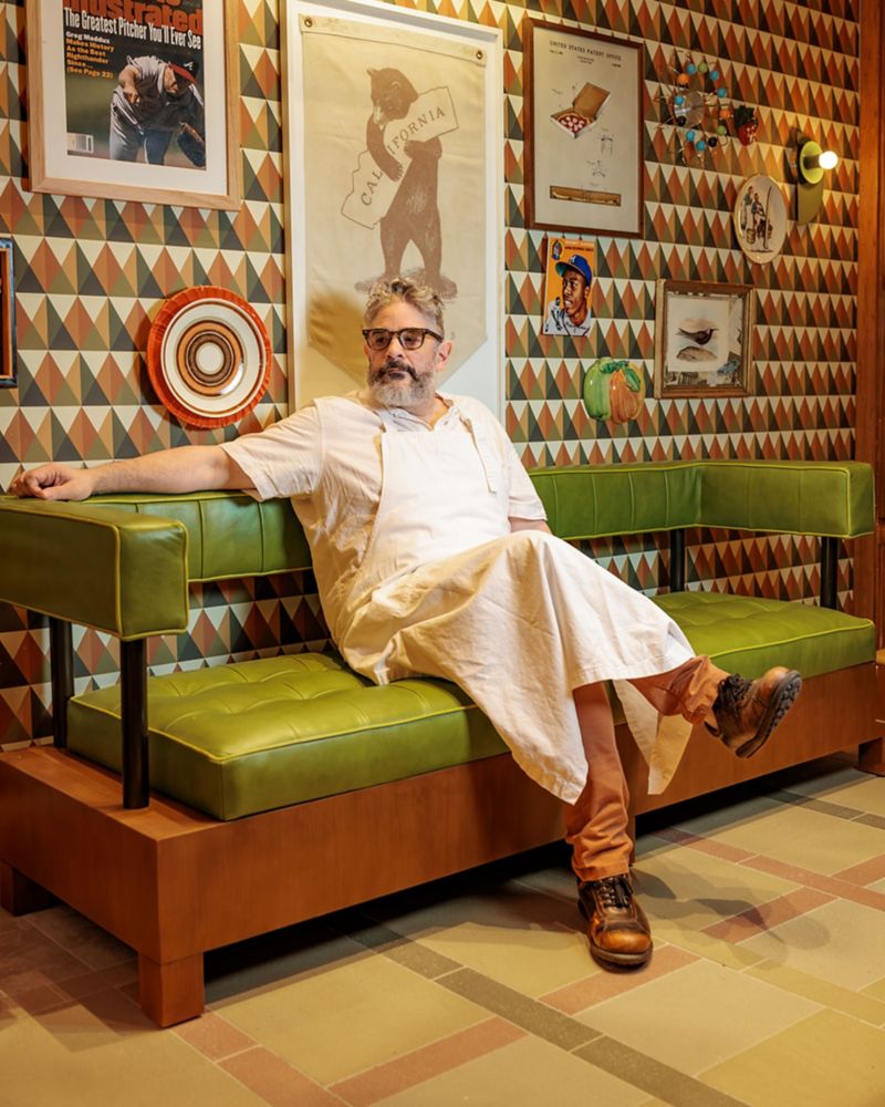 Chef Jeremy Fox sitting on a green couch