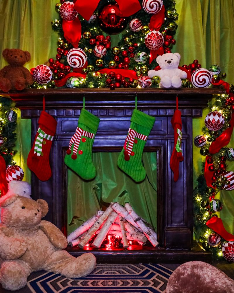 festive bed with teddy bears on it
