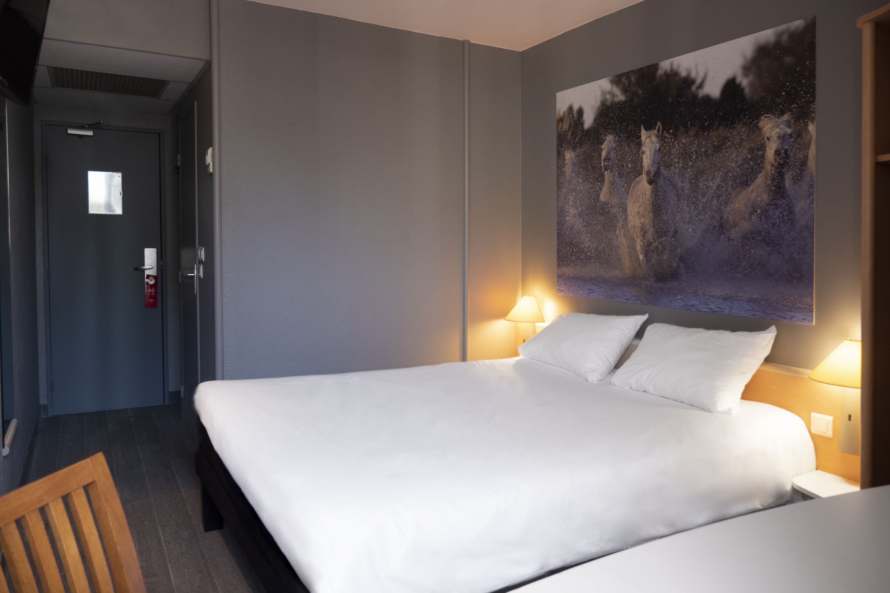 Serene Hotel Room with Majestic Horse Artwork