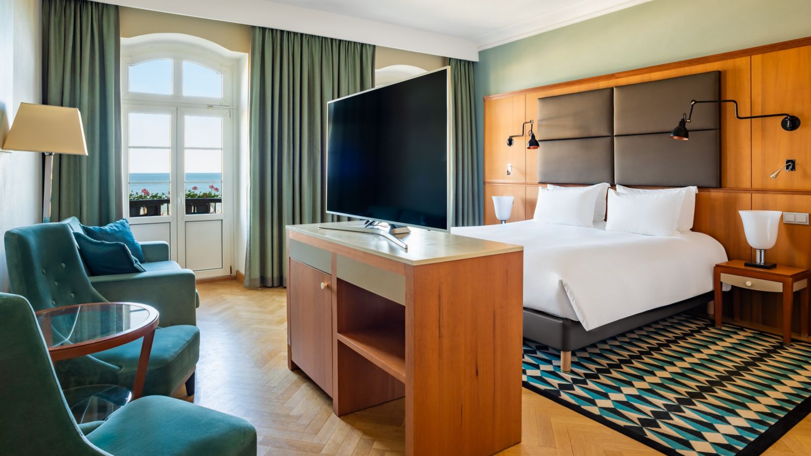 Spacious and bright hotel room with a sea view