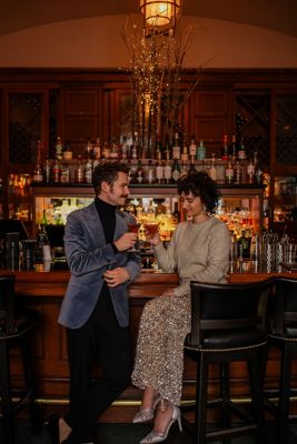 Couple enjoying festive drinks at The Mallard Lounge