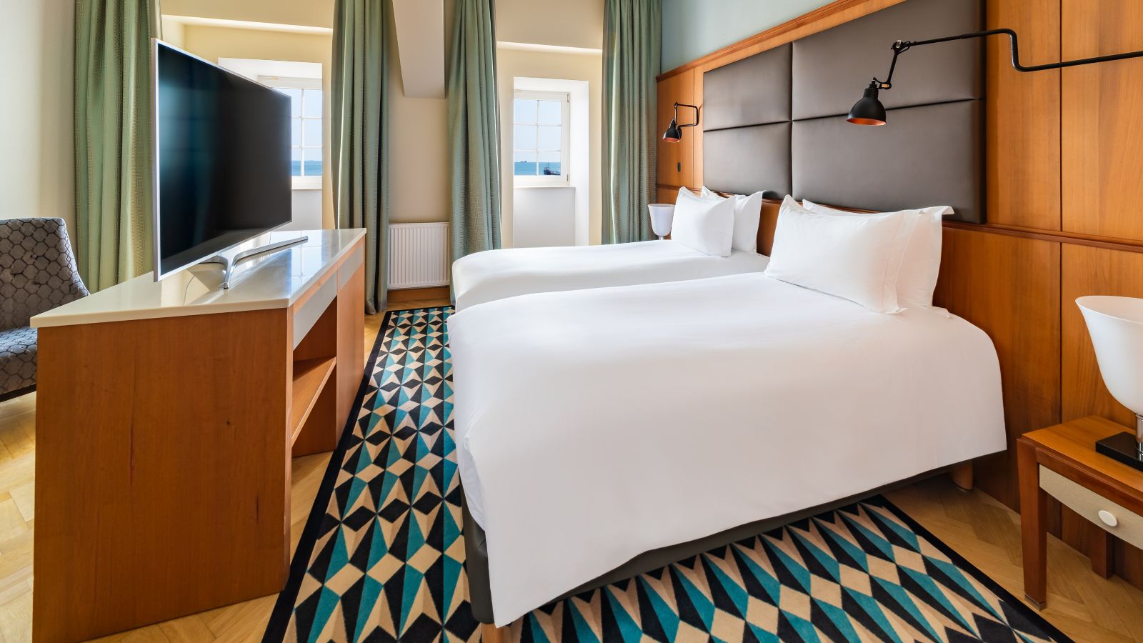 Inviting Hotel Room with Twin Beds and Water View