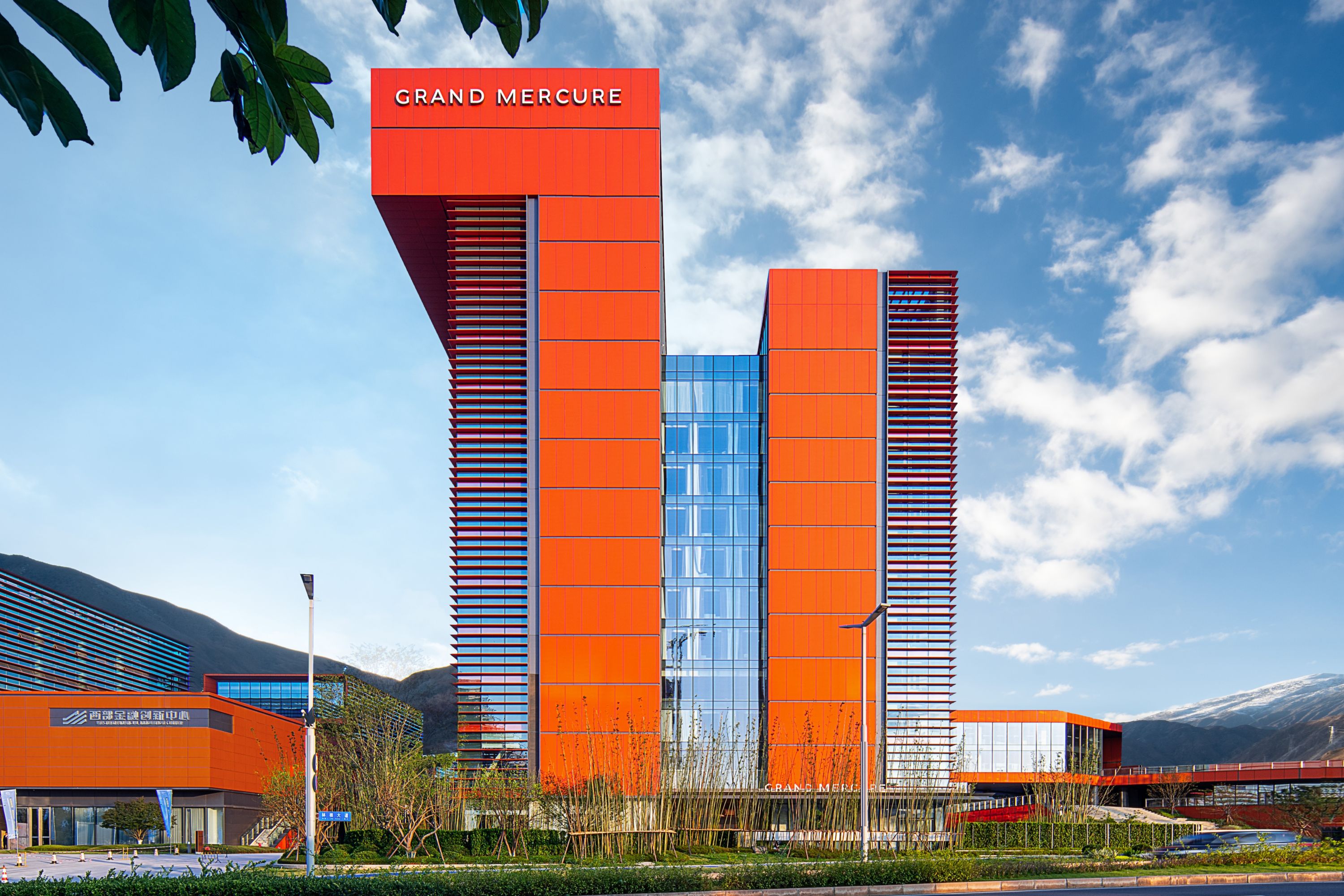 Grand Mercure Hotel: Modern Architecture Against a Scenic Mountain Backdrop