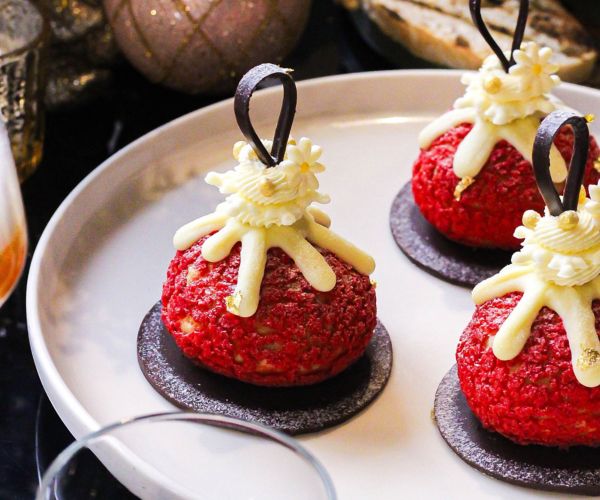 christmas bauble themed desserts on white plate
