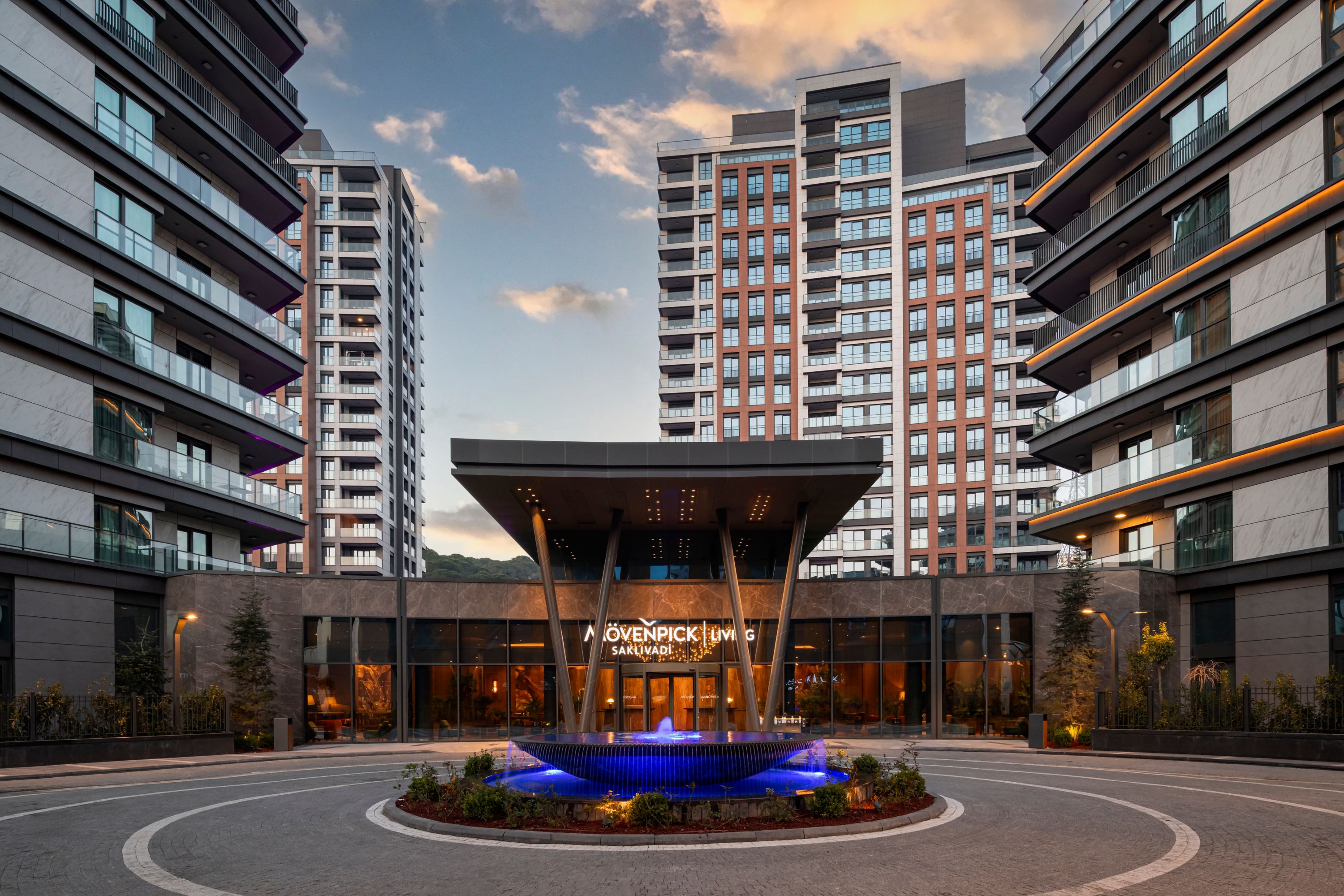Mövenpick Living Saklivادی Hotel Entrance at Dusk
