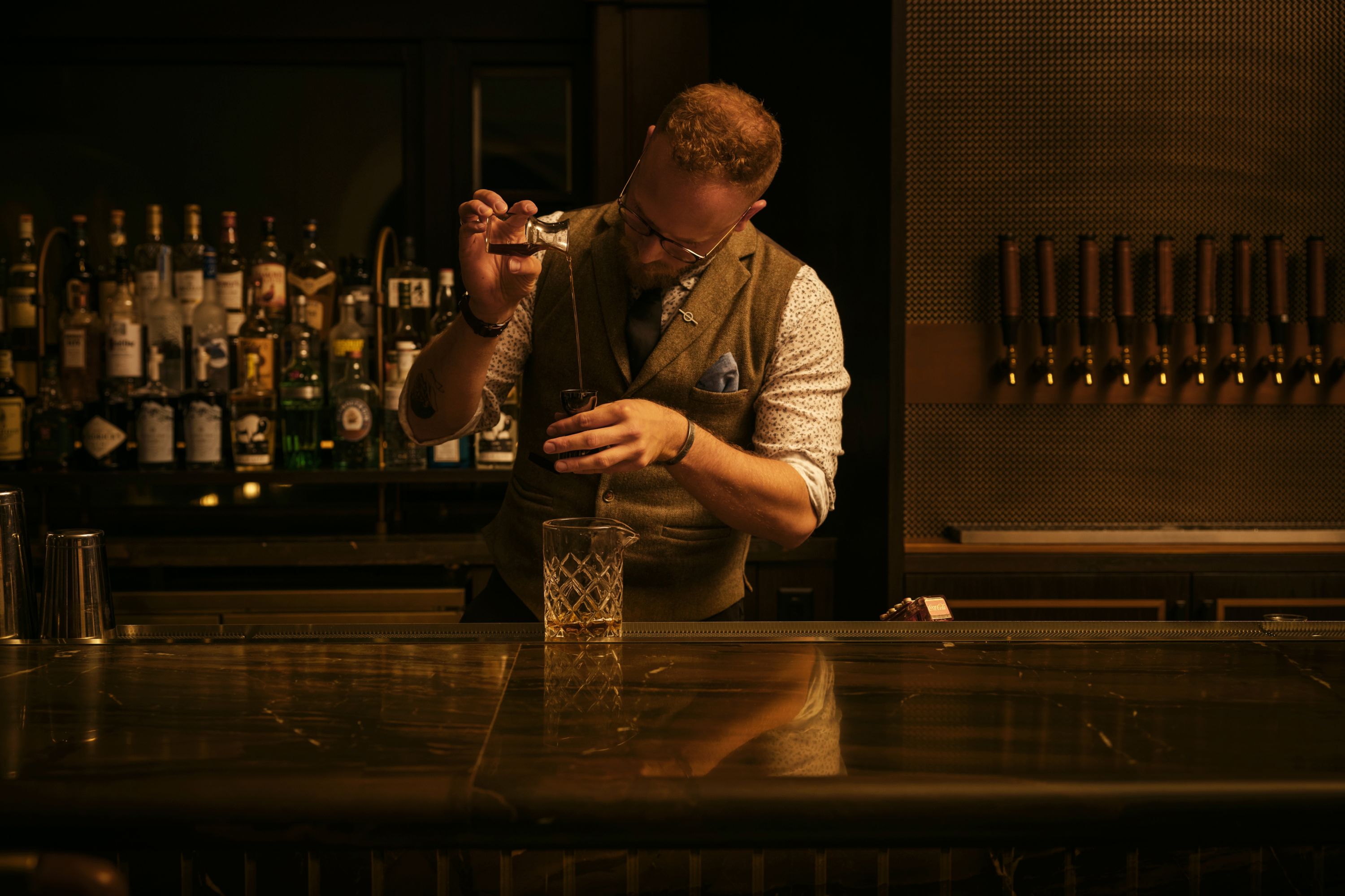 Bartender Crafting a Cocktail in a Hotel Bar