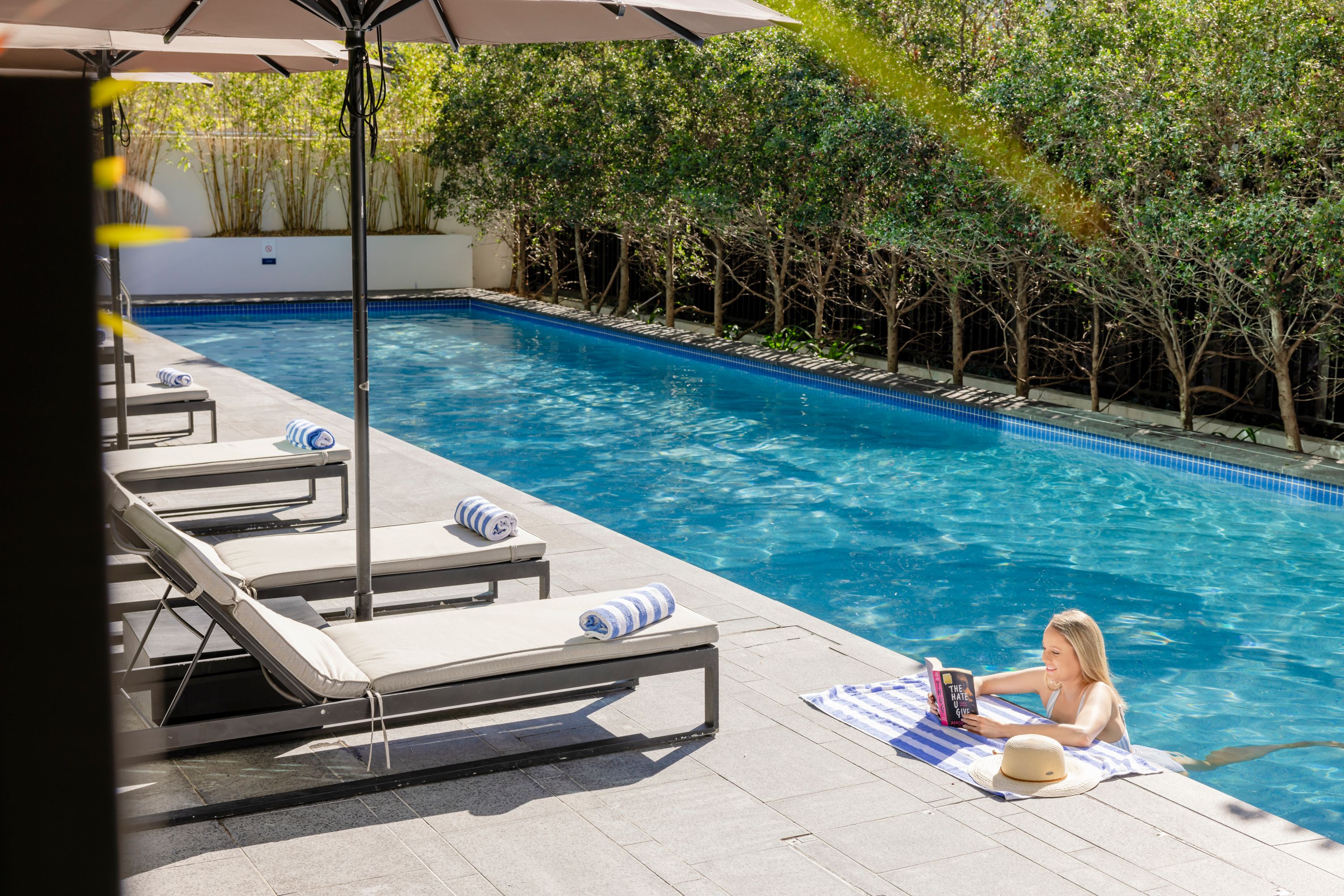 Woman in the pool at Novotel Brisbane South Bank