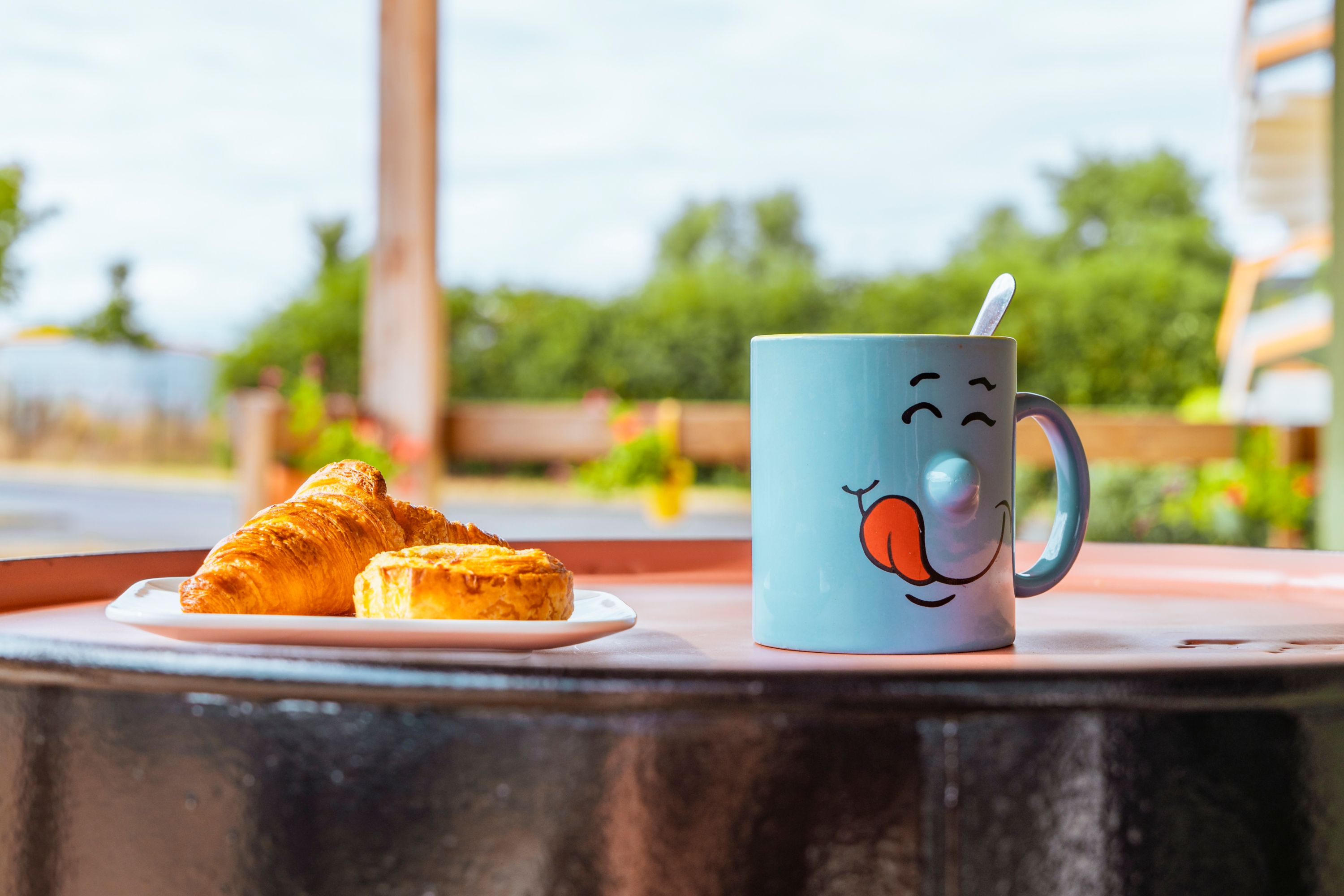 Outdoor Breakfast with a Smiling Mug