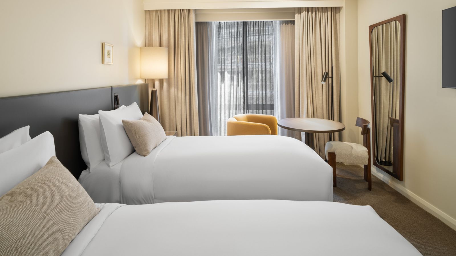 Modern Hotel Room with Twin Beds and City View