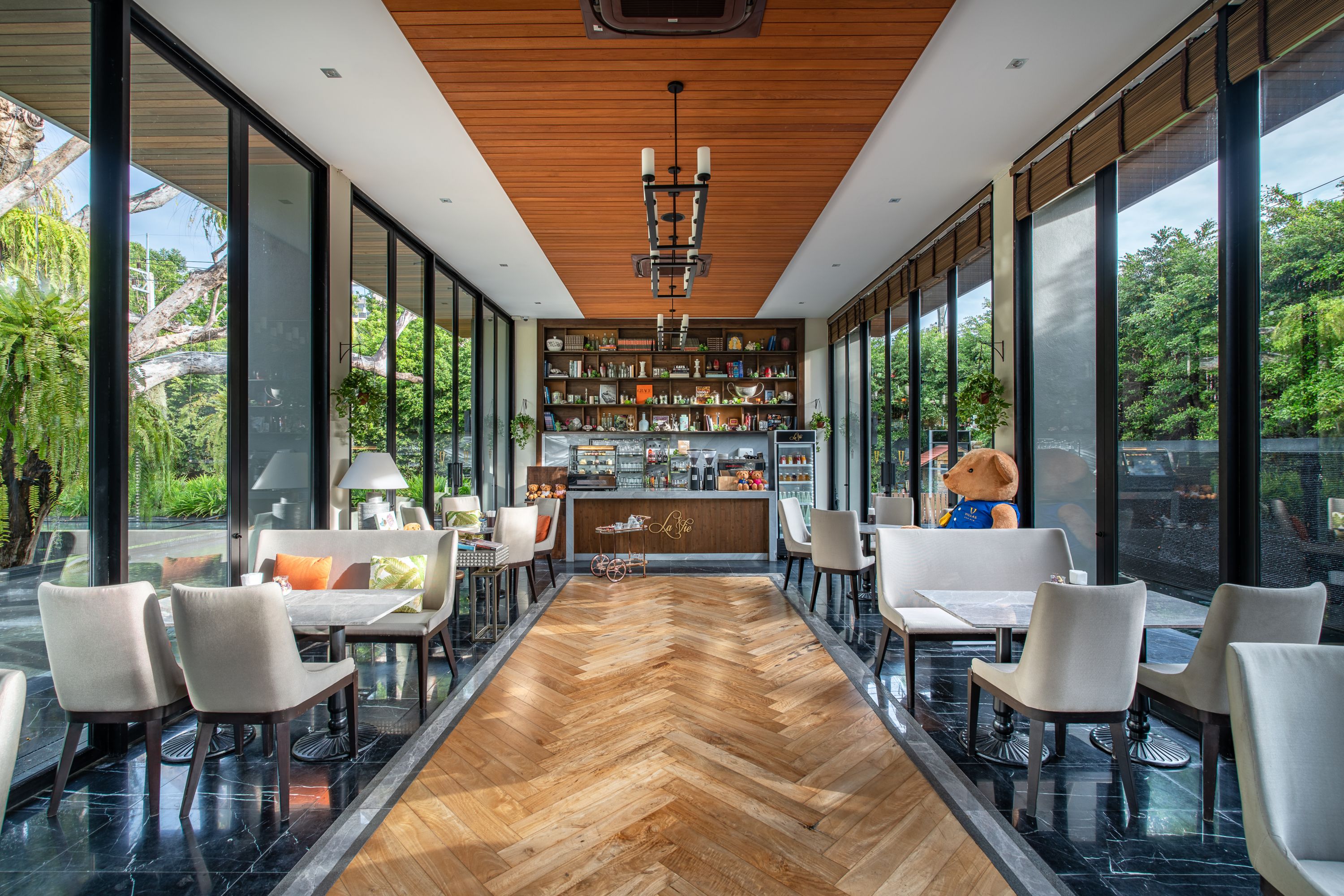 Inviting Cafe Interior with Lush Green Views