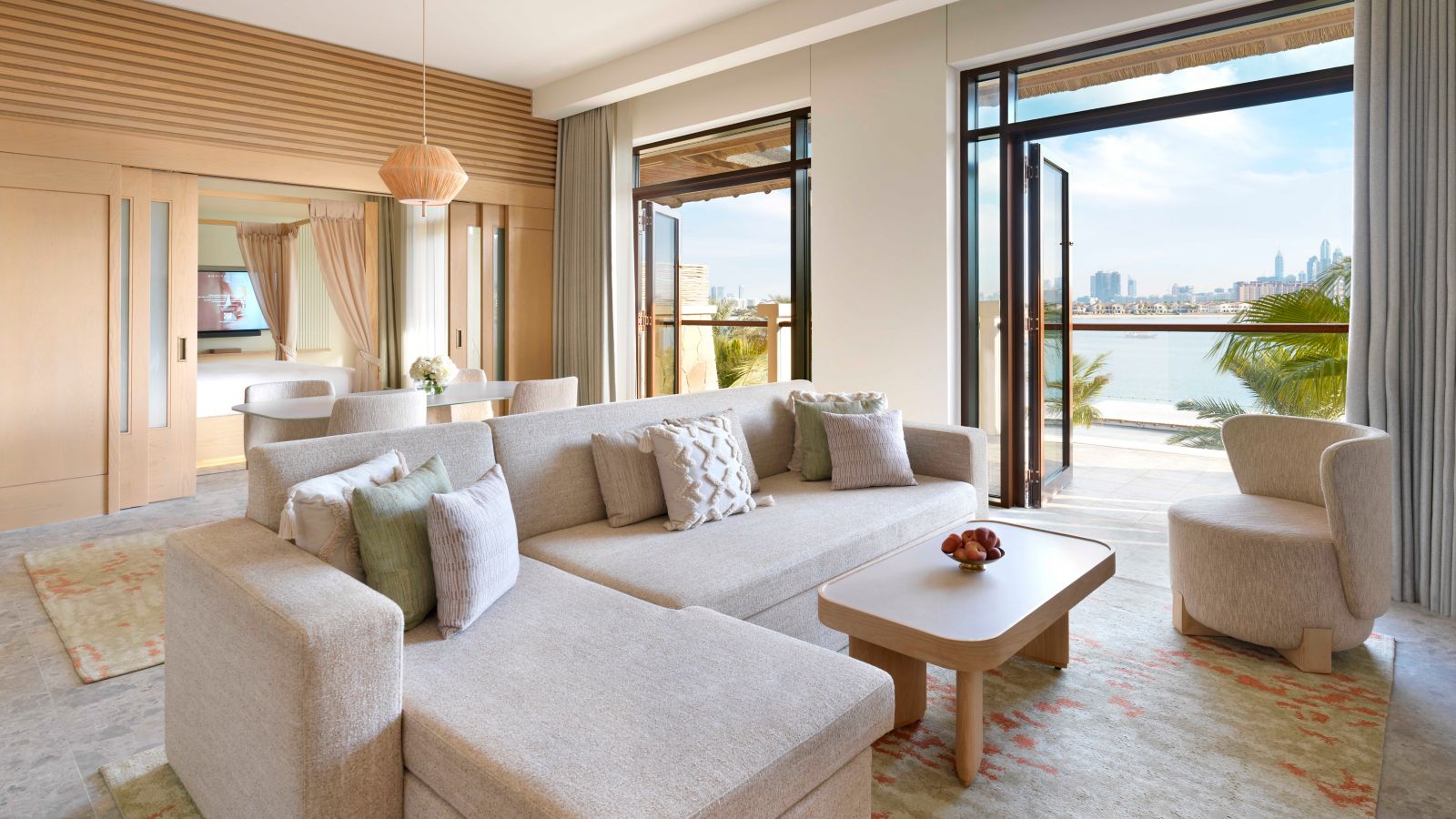 Modern hotel suite overlooking cityscape and waterfront