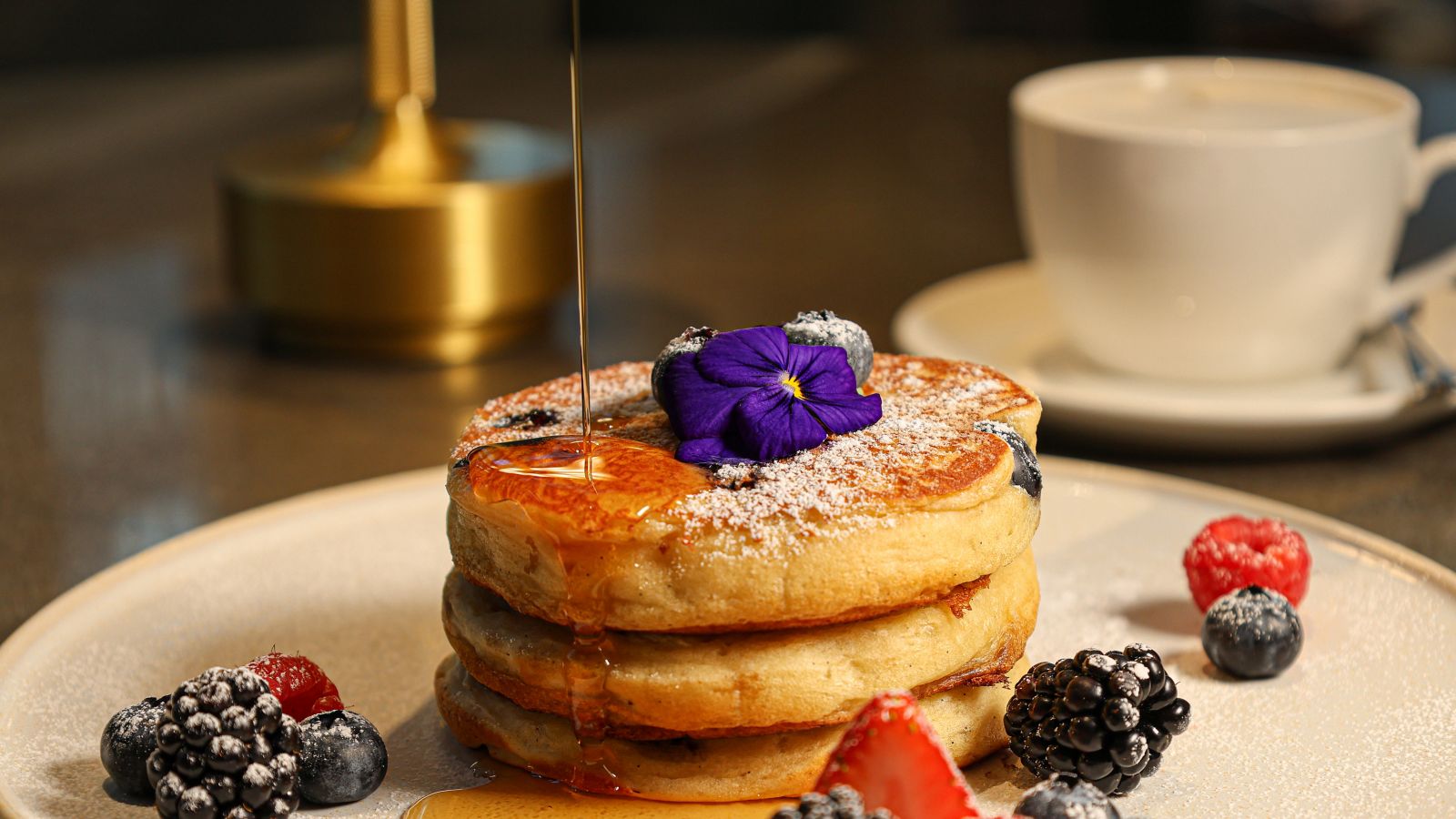 Delicious Pancakes with Berries and Syrup