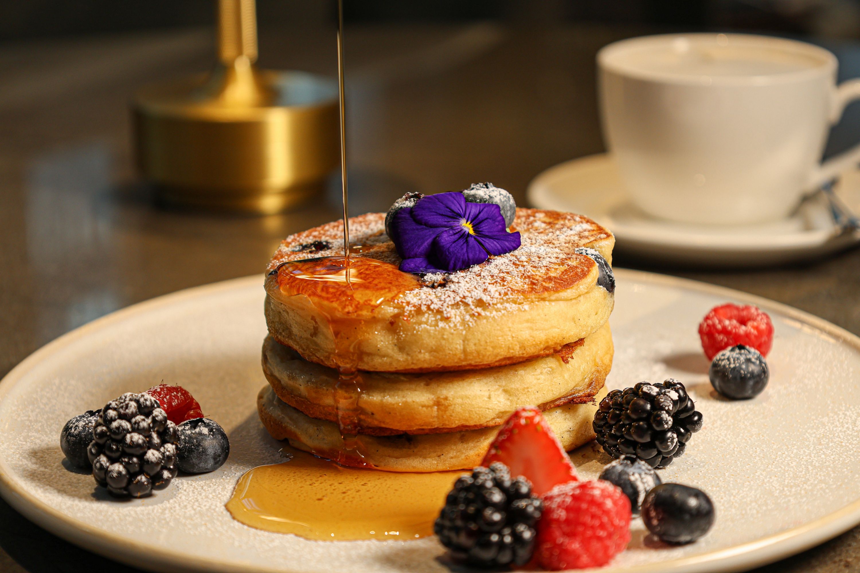 Delicious Pancakes with Berries and Syrup