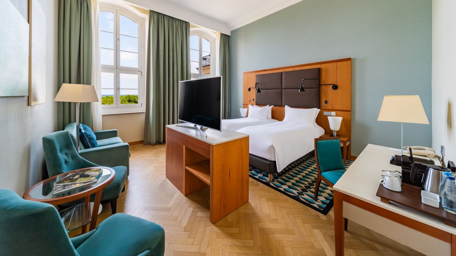 Modern Hotel Room with Twin Beds and Seating Area