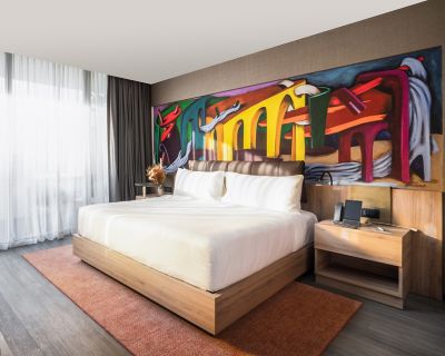 Modern Hotel Room with Vibrant Artwork