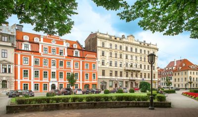 Pullman Riga Old Town hotel's elegant, orange-and-white Neoclassical façade