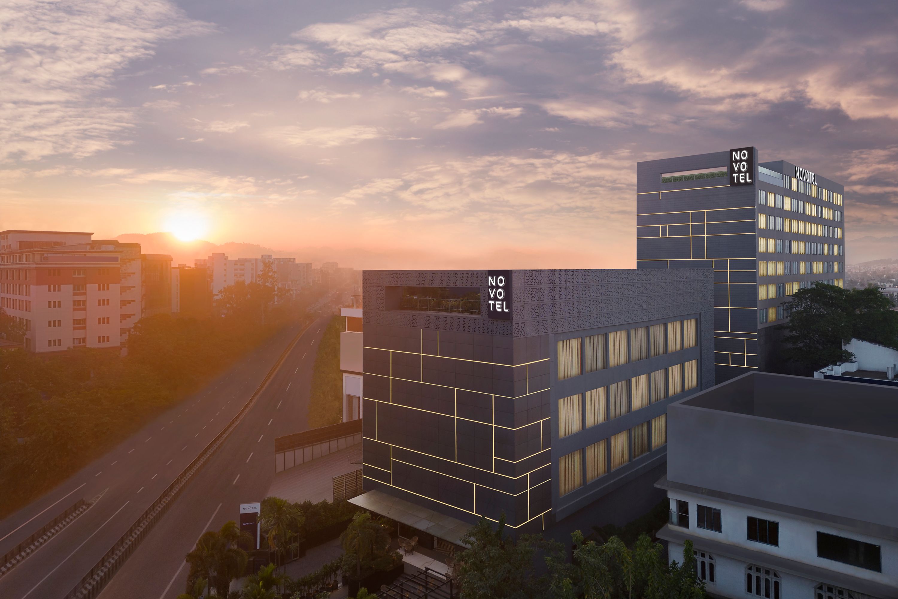 Sunrise Over Novotel Hotel in a Bustling City