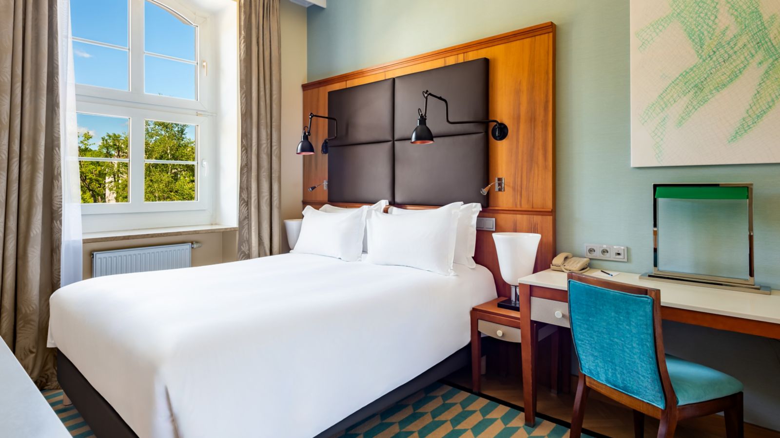 Modern Hotel Room with King-Size Bed and Large Window