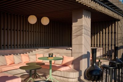 Lounge seating at Novotel Valencia Lavant's rooftop swimming pool and bar