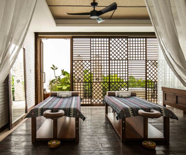 Couple's treatment room at Lola's Sanctuary spa with outdoor bathtub 