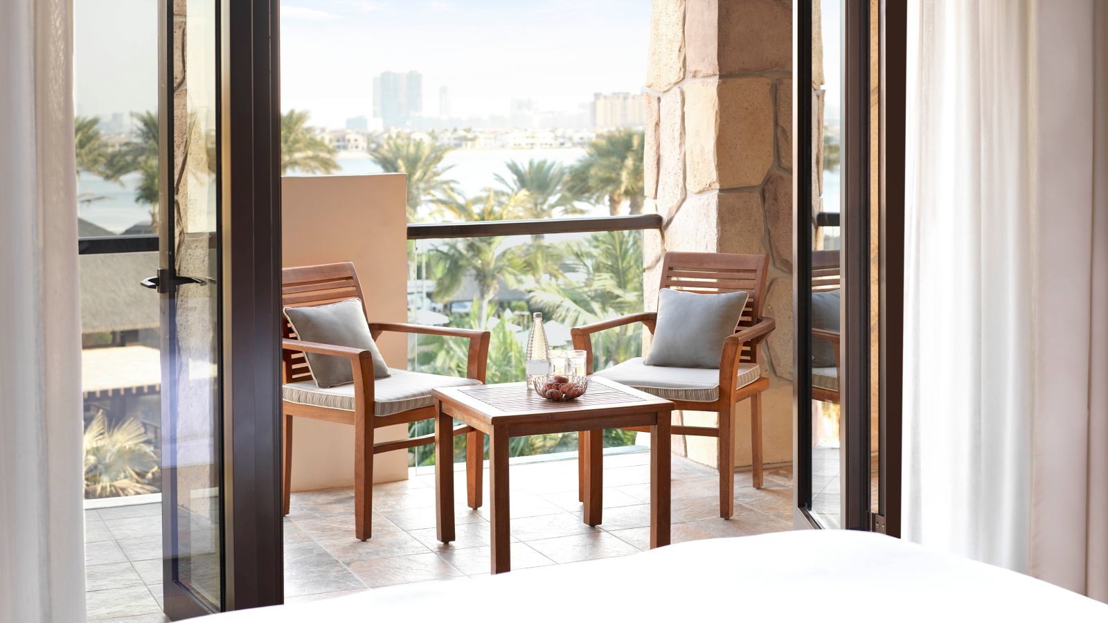 Balcony Bliss: City and Palm Views