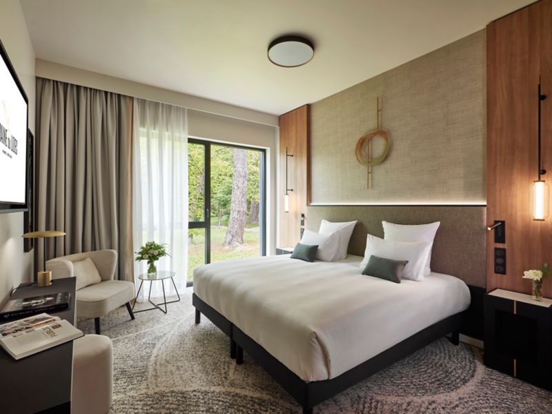 Serene Hotel Room with Forest View at a Domaine du Lac Property