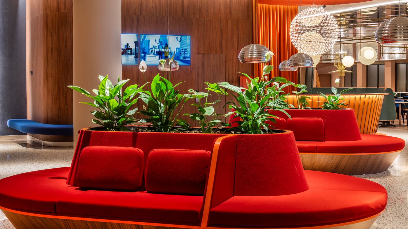 The open-plan lobby at Pullman Riga Old Town, with exposed brick walls and a bar